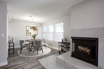 Dining Area and Fire Place at Orange Tree Village Apartments in Tucson